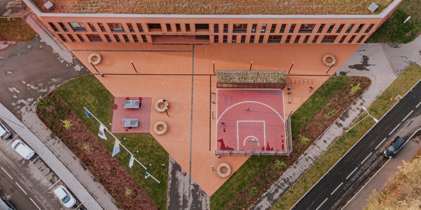 Kohtla-Järve Gymnasium in Kohtla-Järve, Estonia. Used materials: Terca St. John's ceramic bricks and brick slips, Penter Red Rough clay pavers from Aseri plant (Estonia).