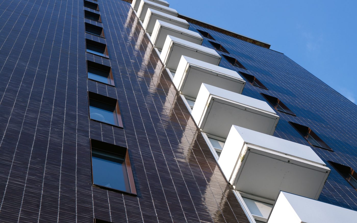 Renovation Elsevier Office Building for Student Housing, Sara Burgerhartstraat, Amsterdam. Completion Date: 2015. Contractor: N.J. de Nijs en Zonen. Architect: Knevel architecten, Amsterdam. Photographer: Leonard Fäustle. Bricks: Terca glazed bricks.