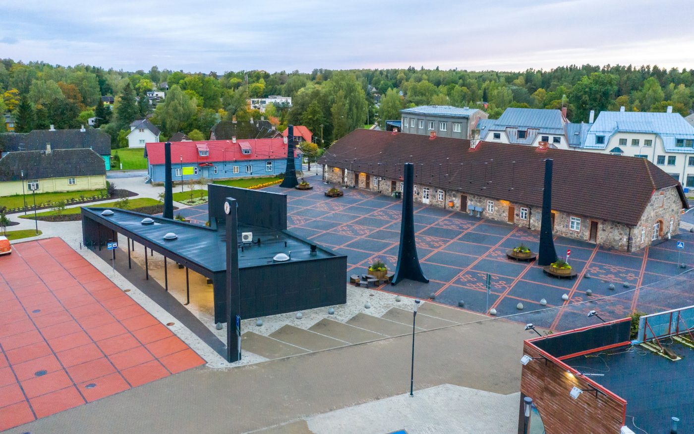 The central square in the town of Tõrva, Tõrva tower and bus station, ,Estonia. Used materials: Penter pavers Red Rough and Grafit Rough from Aseri plant (Estonia). Architect: Arhitektuuribüroo Arhitekt Must OÜ (Mari Rass, Ott Alver, Alvin Järving). Designer: Novarc Group AS. Client: Tõrva Linnavalitsus. Constructor: AS Merko Ehitus Eesti. Photographer: Arno Mikkor.
