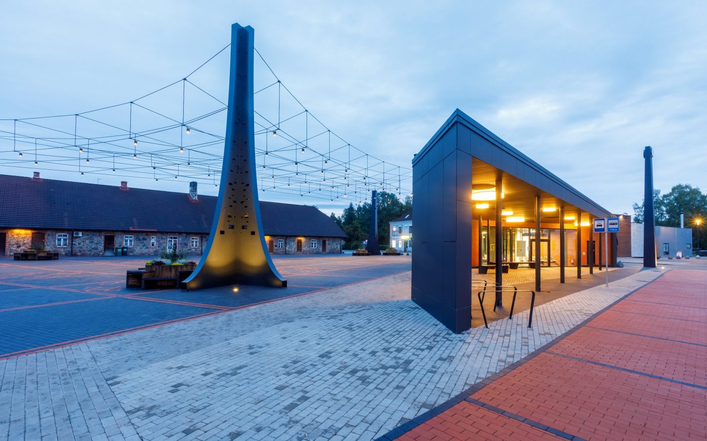 The central square in the town of Tõrva, Tõrva tower and bus station, ,Estonia. Used materials: Penter pavers Red Rough and Grafit Rough from Aseri plant (Estonia). Architect: Arhitektuuribüroo Arhitekt Must OÜ (Mari Rass, Ott Alver, Alvin Järving). Designer: Novarc Group AS. Client: Tõrva Linnavalitsus. Constructor: AS Merko Ehitus Eesti. Photographer: Arno Mikkor.