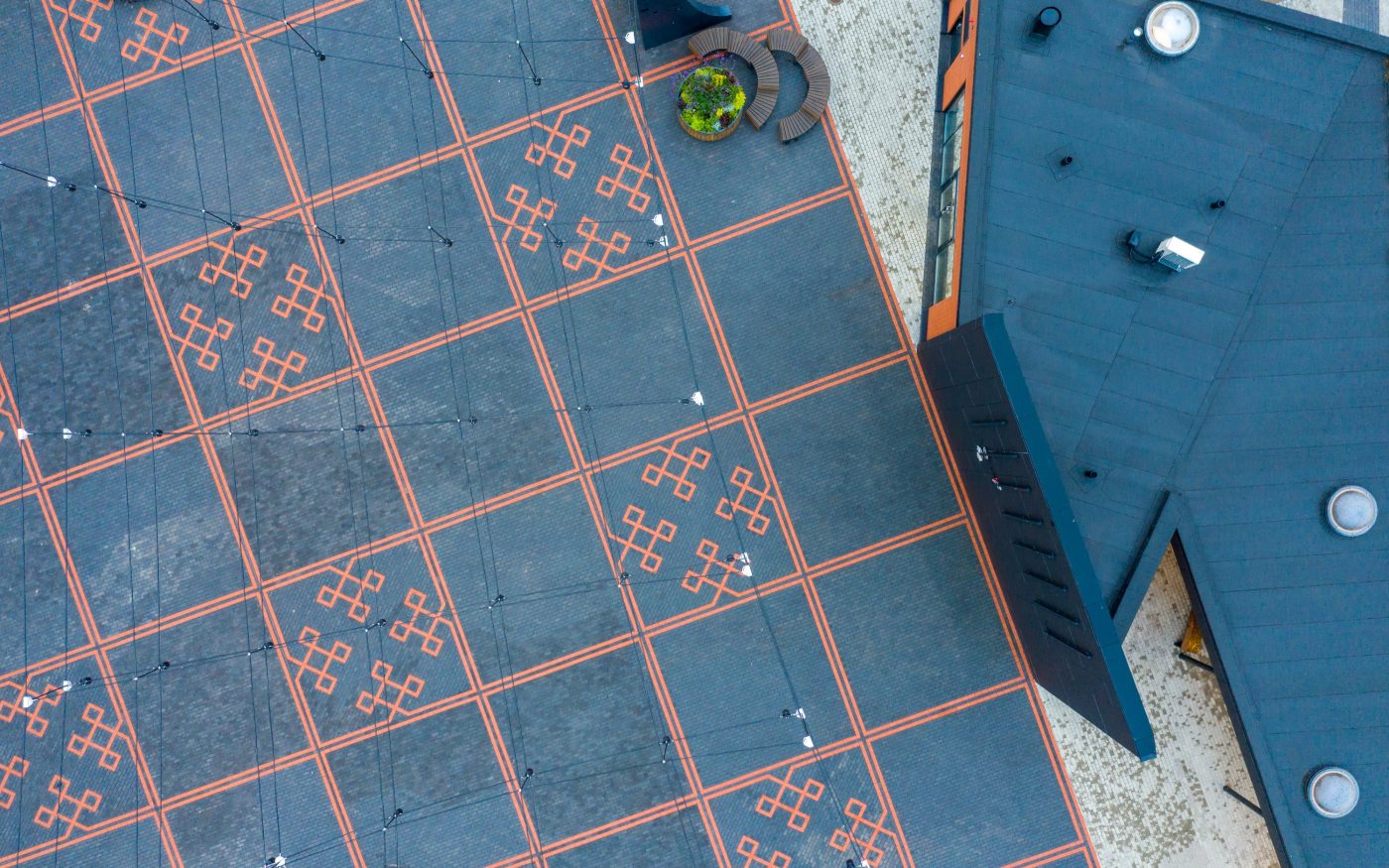 The central square in the town of Tõrva, Tõrva tower and bus station, ,Estonia. Used materials: Penter pavers Red Rough and Grafit Rough from Aseri plant (Estonia). Architect: Arhitektuuribüroo Arhitekt Must OÜ (Mari Rass, Ott Alver, Alvin Järving). Designer: Novarc Group AS. Client: Tõrva Linnavalitsus. Constructor: AS Merko Ehitus Eesti. Photographer: Arno Mikkor.