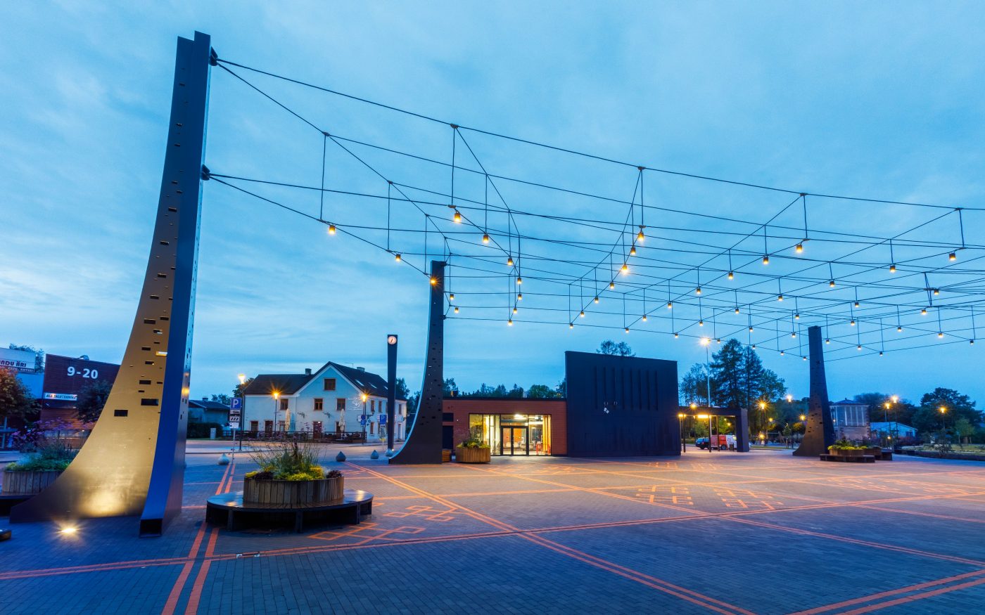 The central square in the town of Tõrva, Tõrva tower and bus station, ,Estonia. Used materials: Penter pavers Red Rough and Grafit Rough from Aseri plant (Estonia). Architect: Arhitektuuribüroo Arhitekt Must OÜ (Mari Rass, Ott Alver, Alvin Järving). Designer: Novarc Group AS. Client: Tõrva Linnavalitsus. Constructor: AS Merko Ehitus Eesti. Photographer: Arno Mikkor.