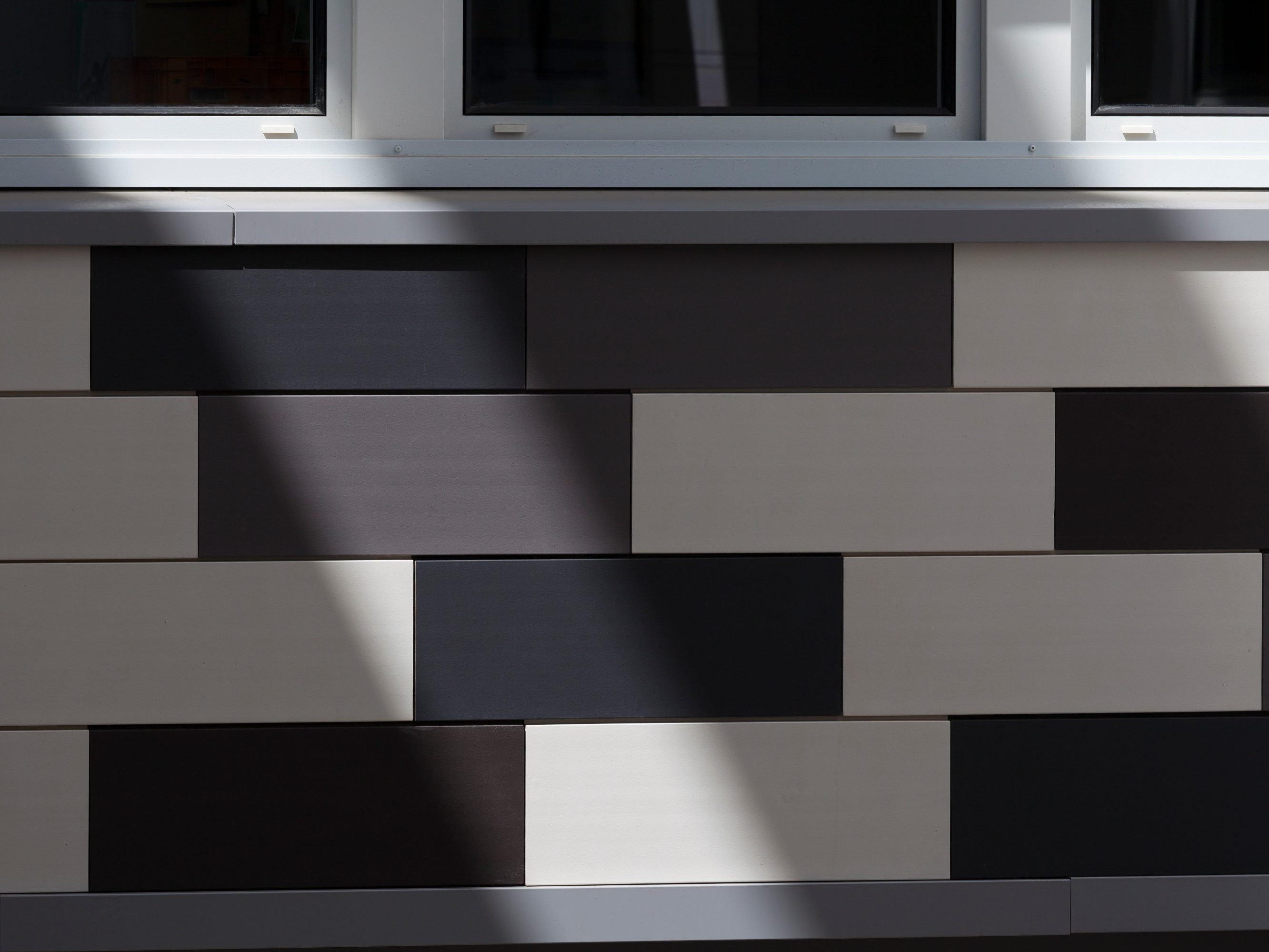 Plublic space with 4 levels. Rue Nationale 59000 Lille. Products Argelite tints  blanc carrare, gris basalte, gris métal.