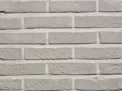 Packshot of a panel with Agora zilvergrijs facing bricks